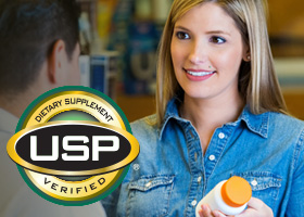 woman holding bottle with USP verified mark