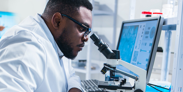African-American scientist working on a vaccine in a modern scientific research lab